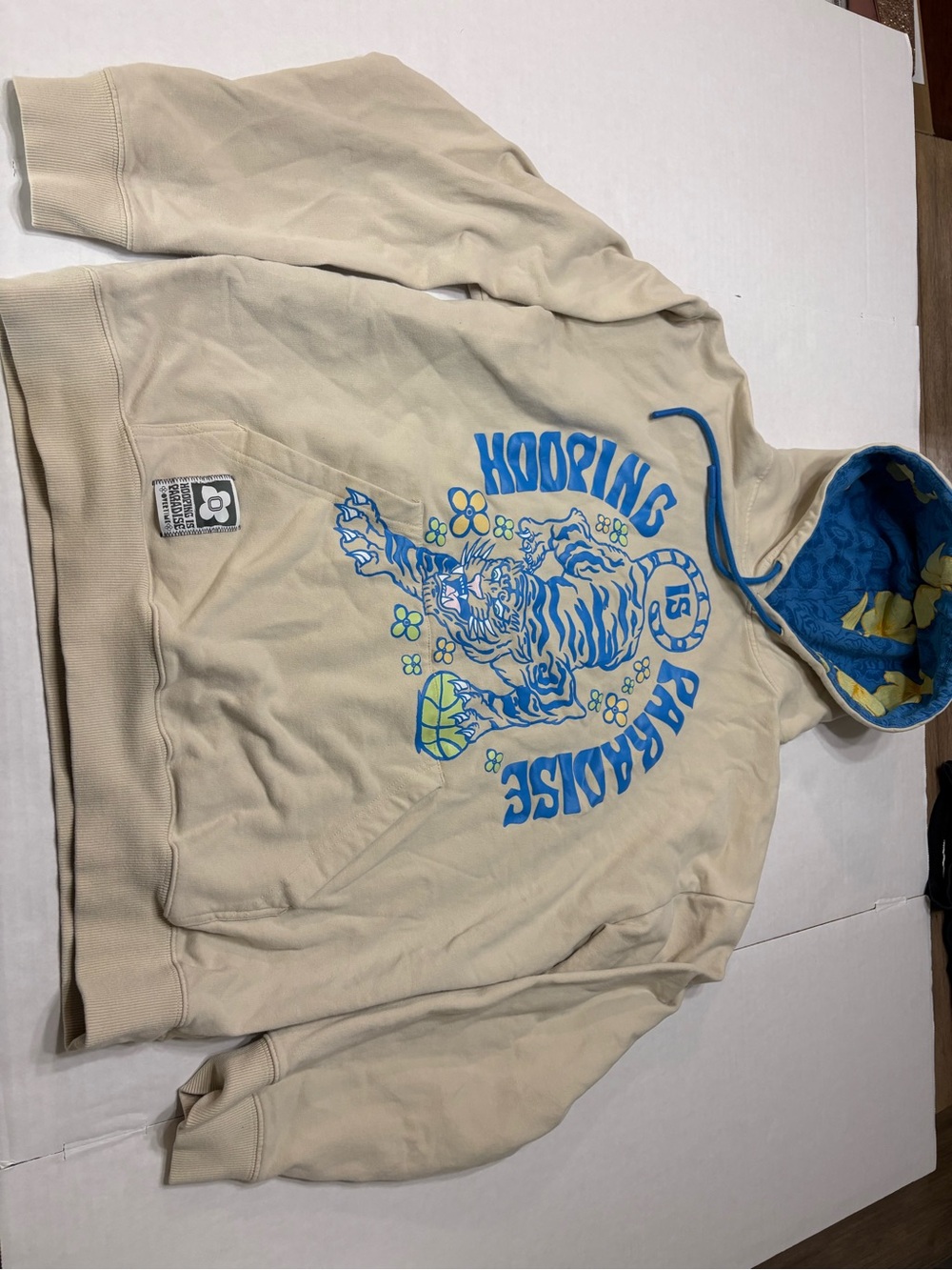 Hooping Paradise Beige Graphic Hoodie with Blue Accents